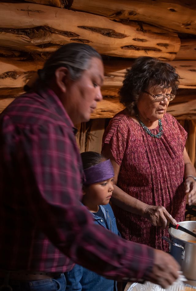 Native American family preparing food