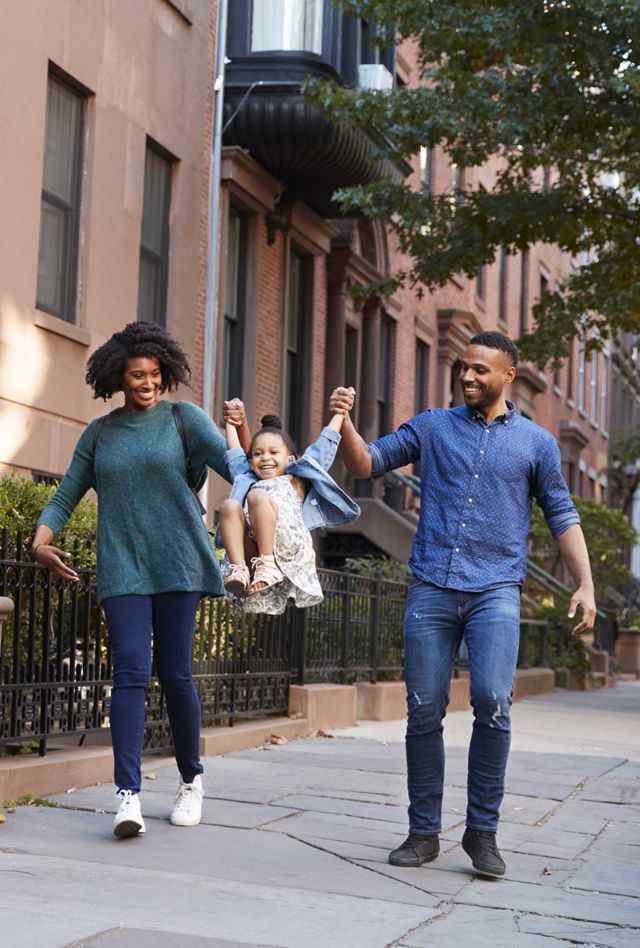 Family taking a walk down the street, close up