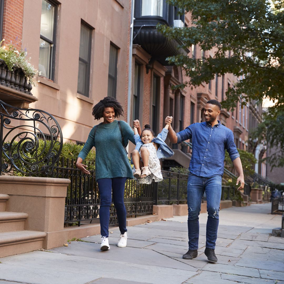 Family taking a walk down the street, close up