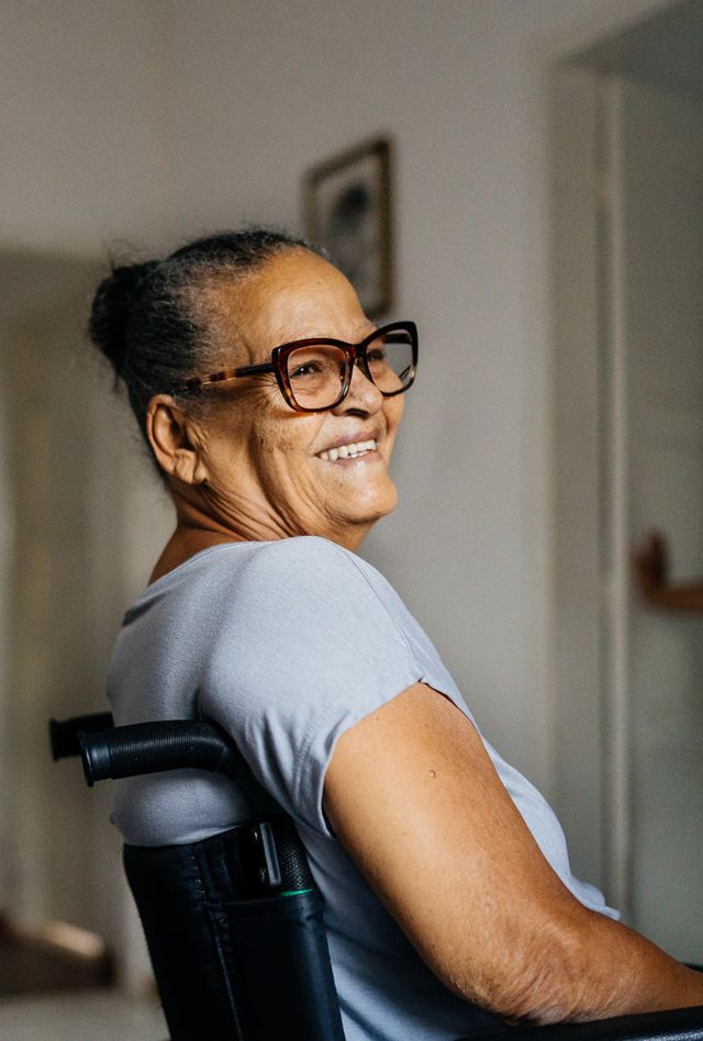 Wheelchair woman smiling in the room