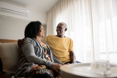 Senior couple looking at each other at home