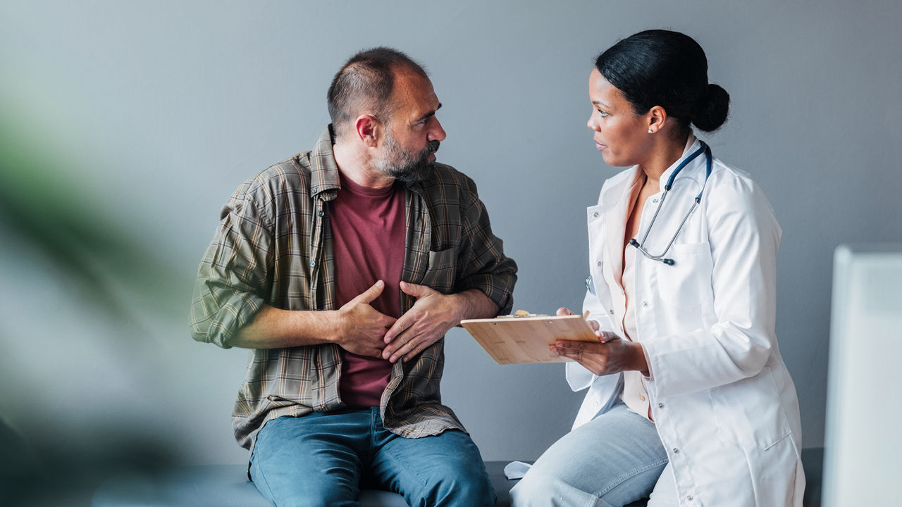 Gastrointestinal patient holding his lower abdomen.