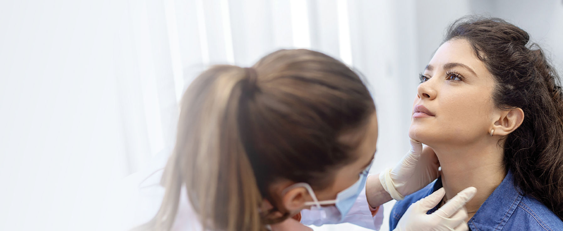 Patient having throat examined. 