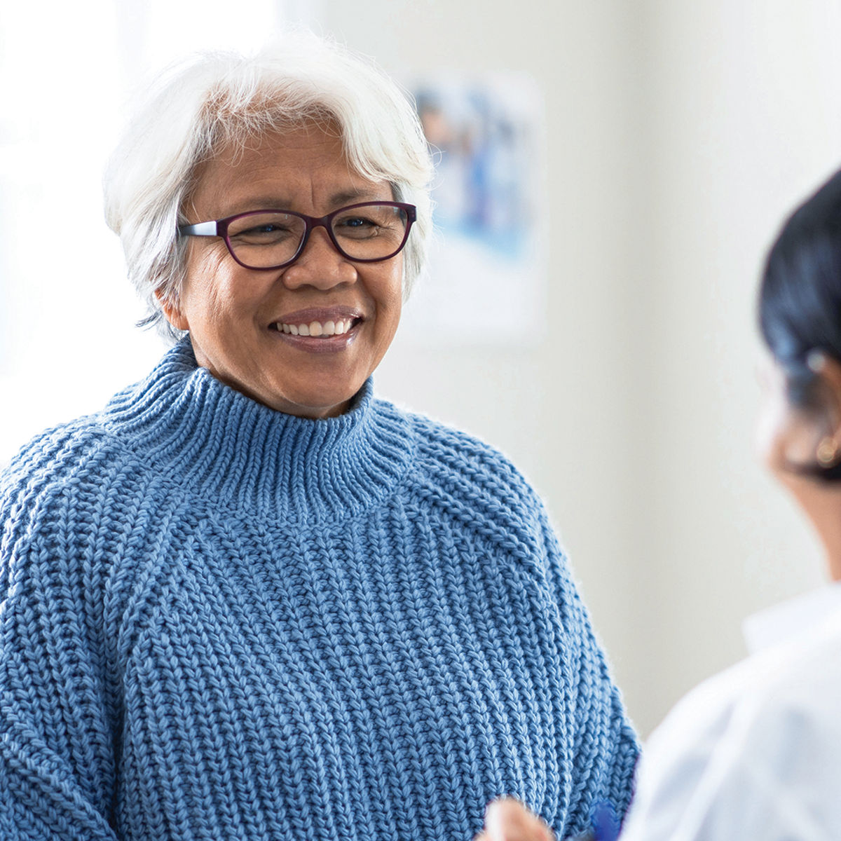Laboratory professional helping a patient./