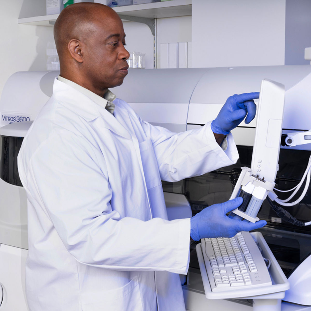 Lab professionals working with testing tools./