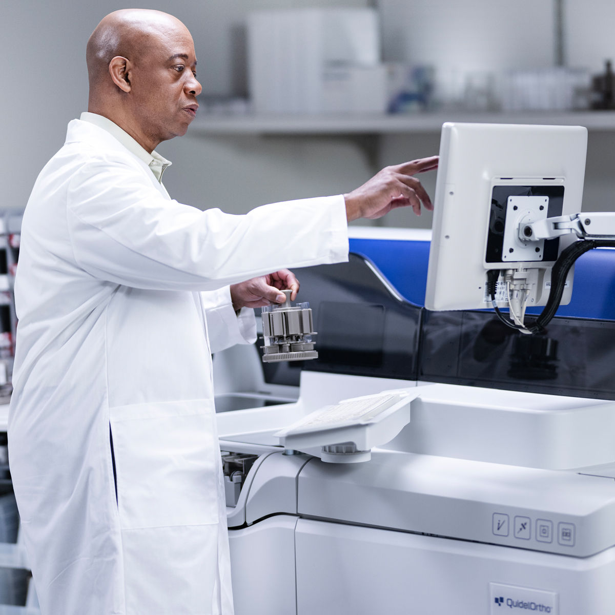 Lab professionals working with testing tools./