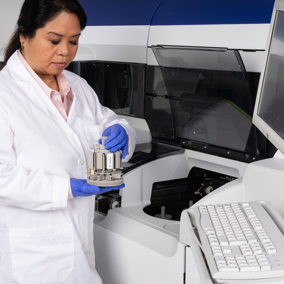 Lab professionals working with testing tools./