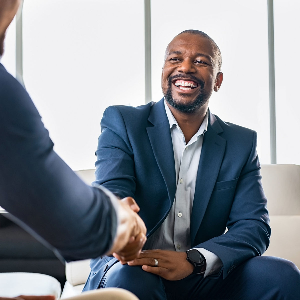 Striking a deal with a happy partner./