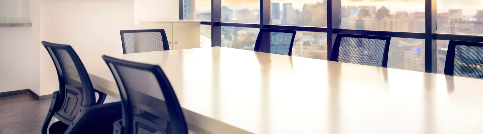 Meeting room with view of cityscape sunset