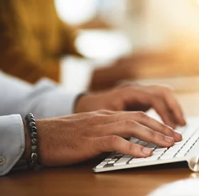 Place of work, man using laptop computer