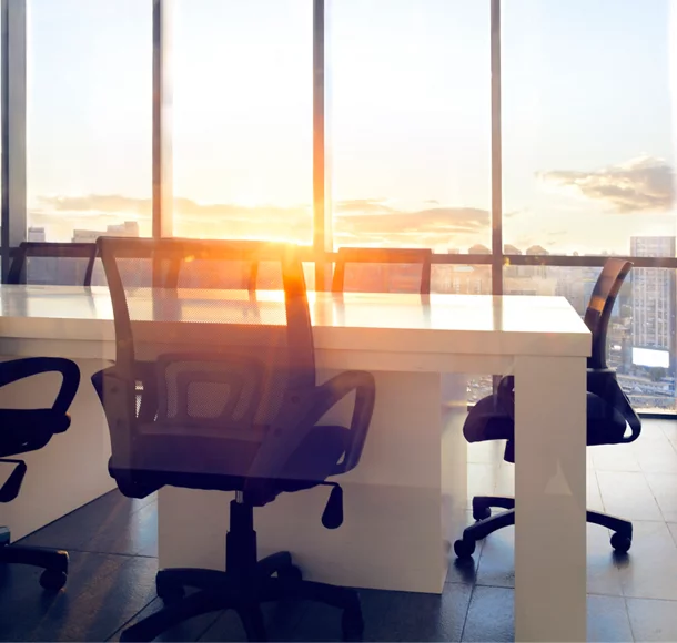 View of office conference room with sunset light in windows