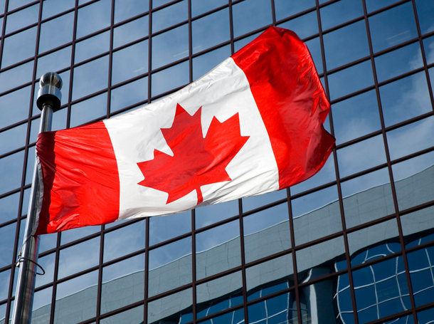 Canadian flag fluttering in wind