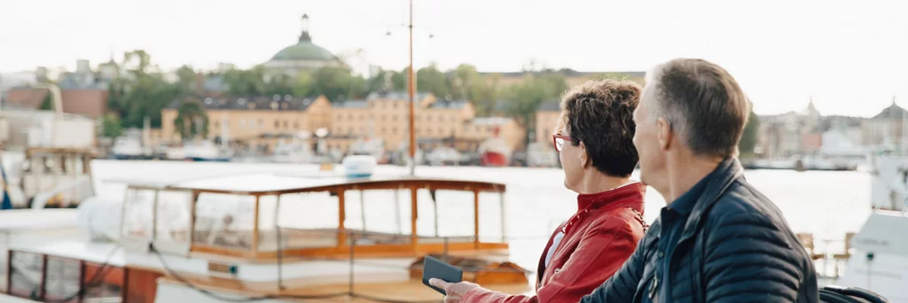 An old couple looking at boats