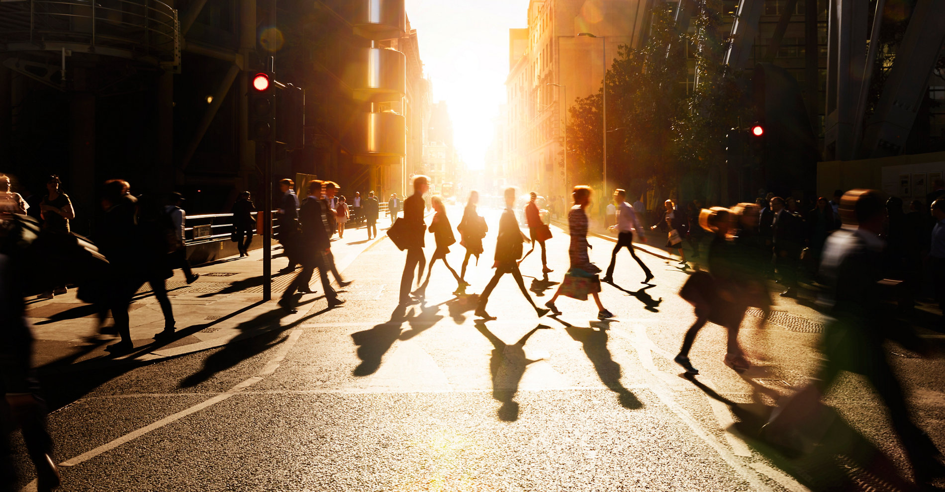 Employees walking to work in the city at sunrise