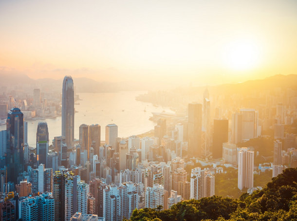 Aerial view of Hong Kong skyline at sunrise.