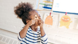 Smiling toddler learning new tricks