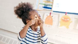 Smiling toddler learning new tricks