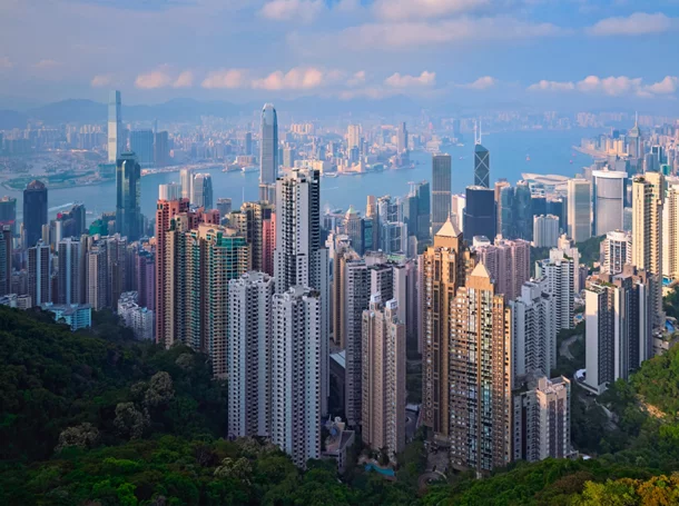 Aerial view of Hong Kong skyline at sunrise.