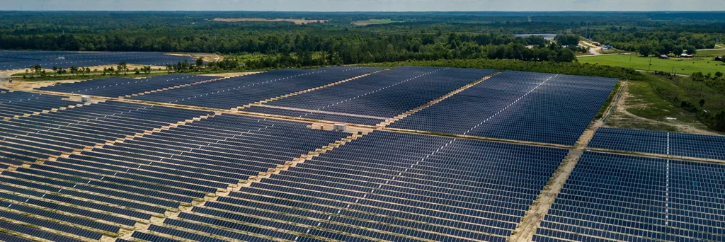 Aerial shot of solar farm filled with solar panels.