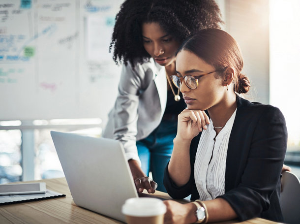 two people looking at a monitor