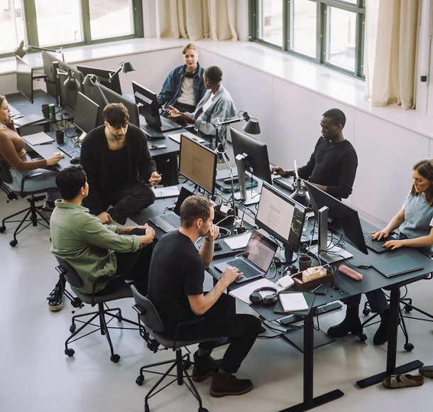 Comapny workers infront of computers