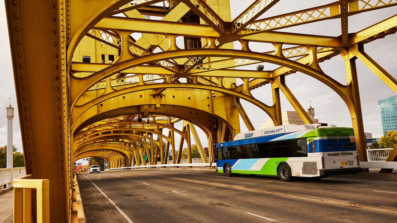 A city bus crosses the Tower Bridge in Sacramento