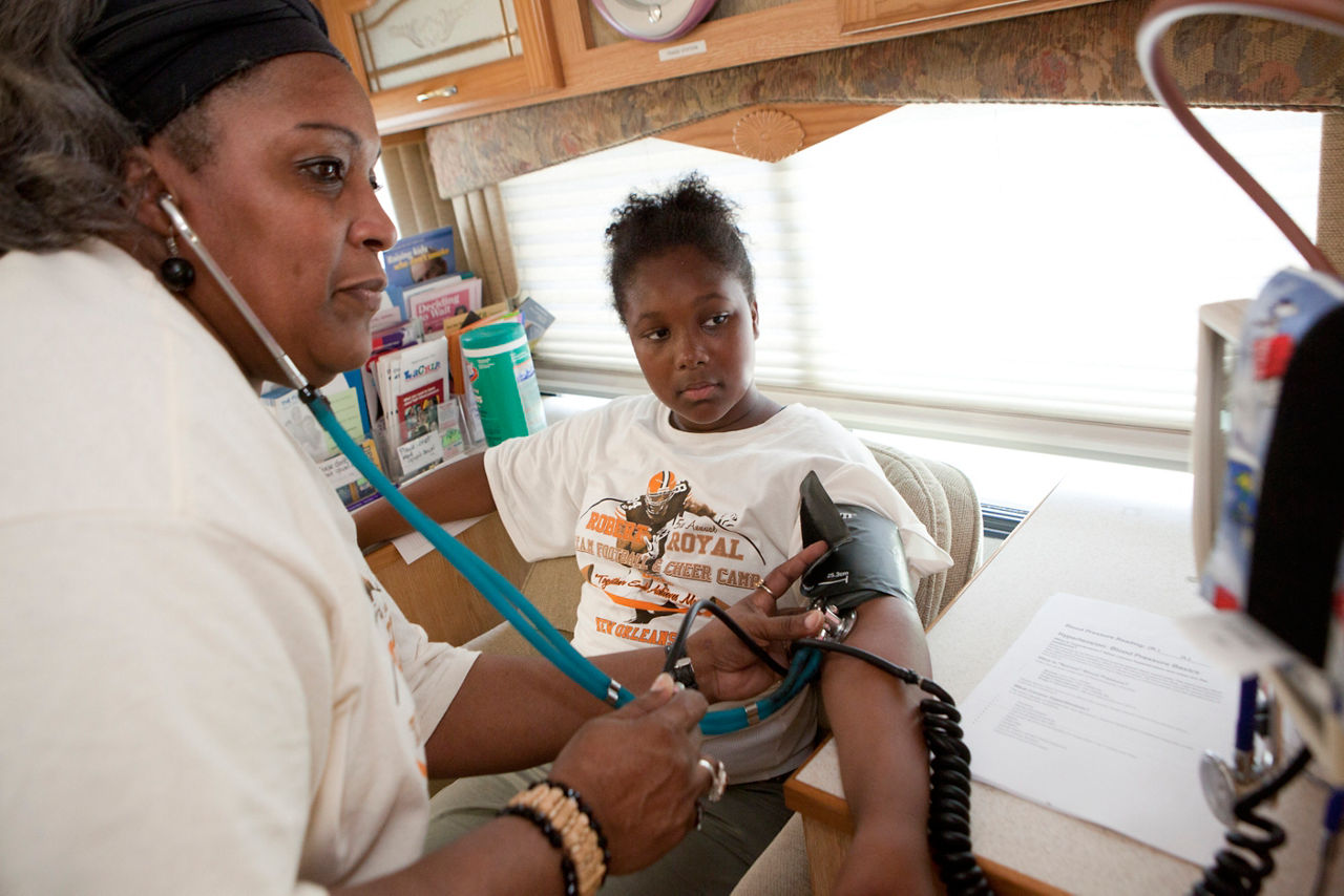 Health Fair and Blood Pressure screening at the Cut Off center in Algiers, La. on July 1, 2011. The health fair, which included the giving out of information about LACHIP and medicaid eligibility, was held during the T.E.A.M. (Together Each Achieves More) Football and Cheerleading Camp put on by NFL player Robert Royal. Everyone is released.