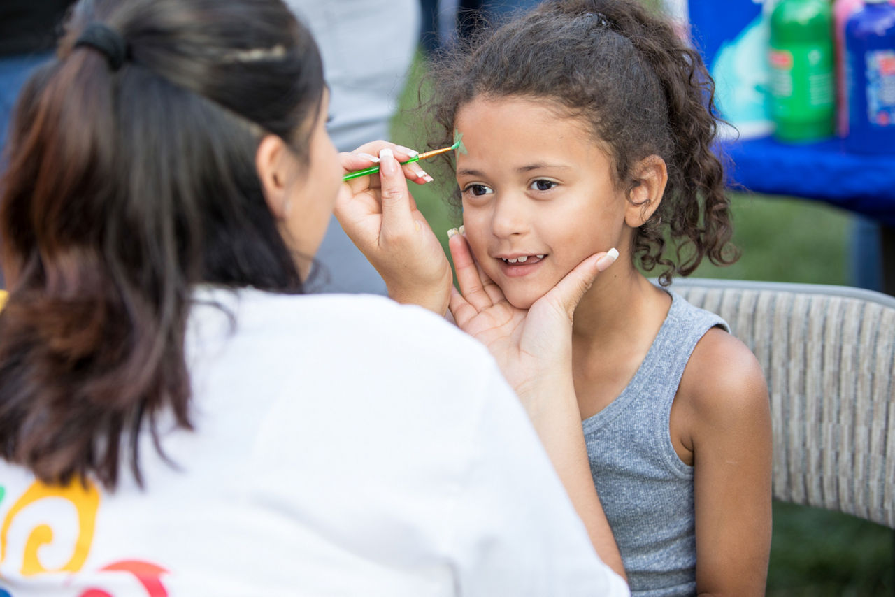 Aerabella Rodriguez has her face painted at the  Break the Violence Event. "BREAK THE VIOLENCE MOVEMENT" IS A GROWING CONCEPT THAT INCLUDES THREE CORE AREAS: 1) PROVIDING SOME FORM OF TEAM BUILDING ACTIVITY 2) HOSTING THE EVENT AT A SAFE ENVIRONMENT 3) A MESSAGE RELATED TO ANTI-VIOLENCE AND/OR PEACE MUST BE SHARED/PRESENT THE EVENT CAN TAKE PLACE INSIDE AN ENCLOSED SPACE OR OUT IN THE OPEN.