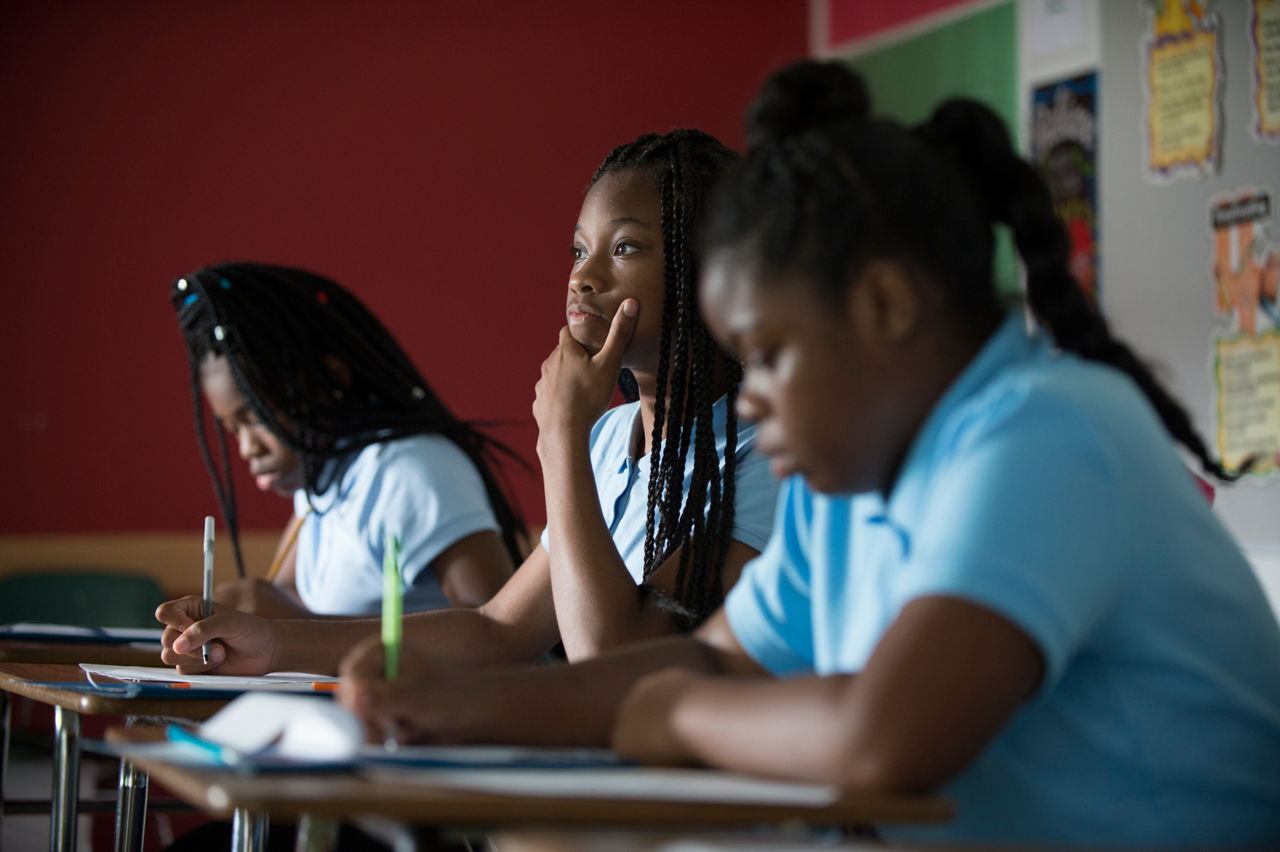 Students at Normandy Seventh and Eighth Grade Center, in northern St. Louis County, learn about raising chickens in preparation for helping to care for the chicken coop on the school grounds. The coop was a project started just last year to offer students a learning alternative to the classroom.