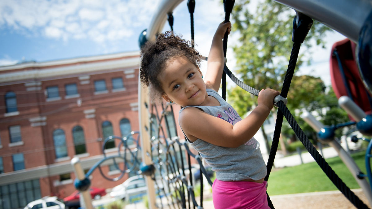Phoenix Bruce, 3, plays on the new playground during the Ninth Annual Cookout and Block Party in Harriman Park in Manchester, N.H. on Thursday, Aug. 18, 2016. The cookout is a chance to bring community members together, but was special this year because of the new playground installed at the park.