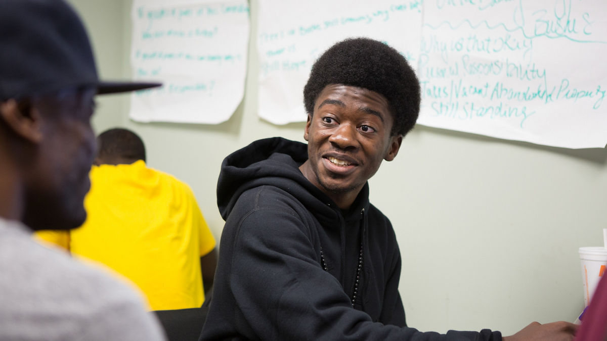RWJF COH Louisville August 25-28, 2016.  Youth Violence Prevention Research Center meeting. Aubrey Williams (hat), Elijah Thomas (black sweatshirt), and Treyvan Neely talk about the writing exercise that the fellows were given. tyrone@tyronefoto.com