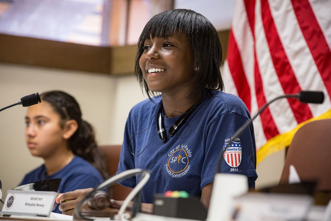 Liliana Bernal (left) and Kimyatta Newby (right) at a meeting of The San Pablo Youth Commission in the San Pablo City Council chambers. Launched seven years ago, the group is an example of how San Pablo is cultivating a new generation of leaders and engaging younger people in the direction of their community. It’s seen as an investment in the city’s quality of life, both present and future. The group advocates for young people: For Example: on lowering the voting age, it sent a letter of support to legislators in Sacramento and got the San Pablo City Council to back up its position.