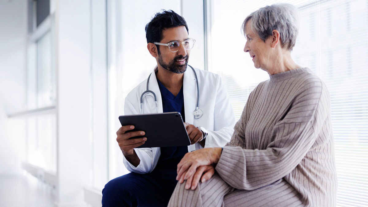 A doctor and patient talking.
