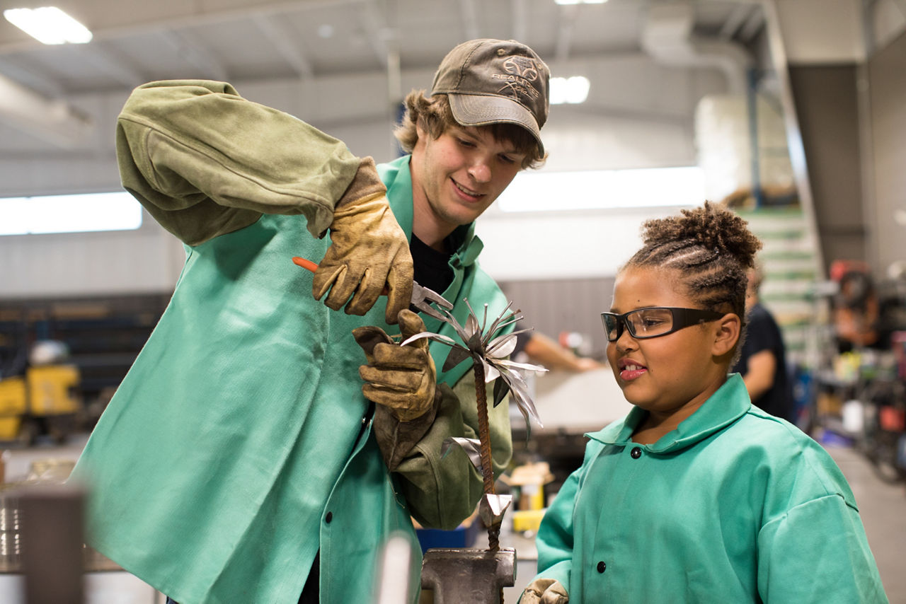 Algoma, WI COH 2017. Nate Broerman (left) is a 12th grader and is teaching Ava Horseley (4th grade) today. Community Fab Lab are classes at Wolf Tech where students teach skills to anyone in the community for free. It's a bridge that often connects youth and folks at an older age.