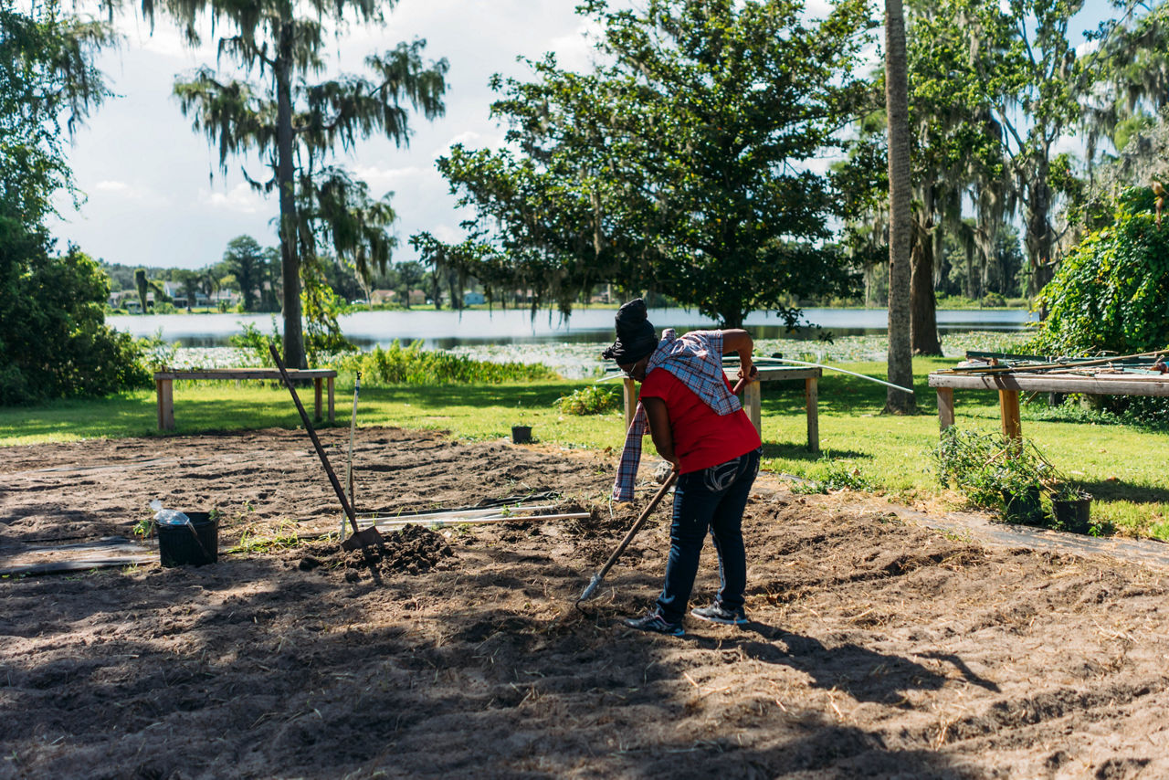 Darlene, working the grounds at Ella Dinkins home.