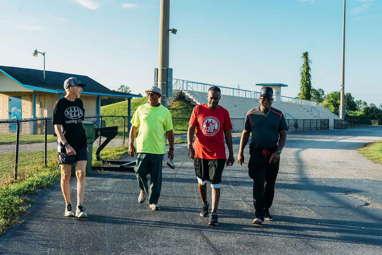 Mayor Edward Cole joins Eatonville community members during the Healthy Walk at the Hungerford Track.