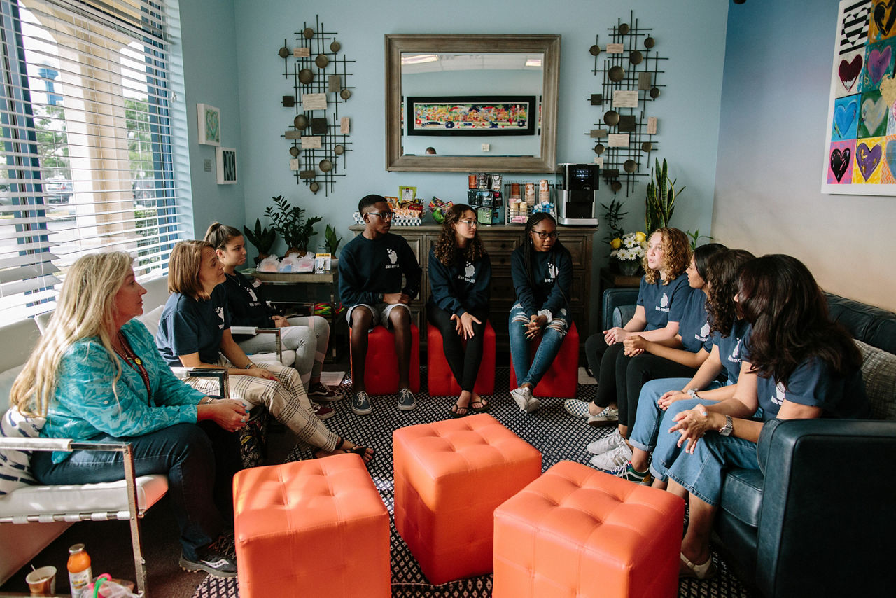 Parkland, FL - August 23, 2019 - Members of the "Mind Body Ambassadors" group from Marjory Stoneman Douglas High School meet at  Eagles' Haven.Next door to a health food store in a strip shopping center, a new drop-in wellness center presents an immediate aura of calm. A circle of teens practices deep breathing exercises. Other young people meet with staff in private rooms, decorated with murals of mountains and motivational sayings like, The best views come after the hardest climbs. This is Eagle’s Haven, and it is just across the highway in the Parkland neighborhood from Marjory Stoneman Douglas High School (MSD), where a lone shooter killed 17 and injured 17 on Feb. 14, 2018.“I wondered, ‘How am I ever going to teach again?’ ” says Diane Wolk-Rogers, a history teacher at MSD. After going through training, she shared what she learned with students, staff and parents. The idea spread, and about 100 students now serve as Mind Body Ambassadors and teach calming techniques to others. The initiative has been so effective that CSC wants to introduce clubs across the school district.