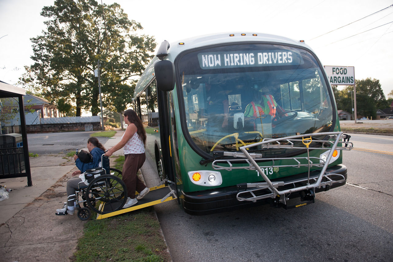 Greenville County resident Rhonda Herrington is wheeled off the bus by her daugher, Holly Herrington, as they ride Greenlink transit on a Wednesday morning. Greenville Transit Authority will utilize a federal grant to expand their service, including later hours and more buses.