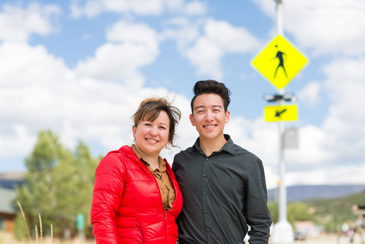 Cristina Reveles and her 19 year old son Brayhan Reveles in front of the new pedestrian crosswalk that connects Colorado Mountain College with Lake County High School across Highway 24 in Leadville, Colorado.  The project was initiated by Brayhan, a Colorado Mountain College student and Healthy Eating/Active Living coordinator at Lake County Build a Generation and his mother Cristina, who has advocated for safe routes to schools since Brayhan was a child.
