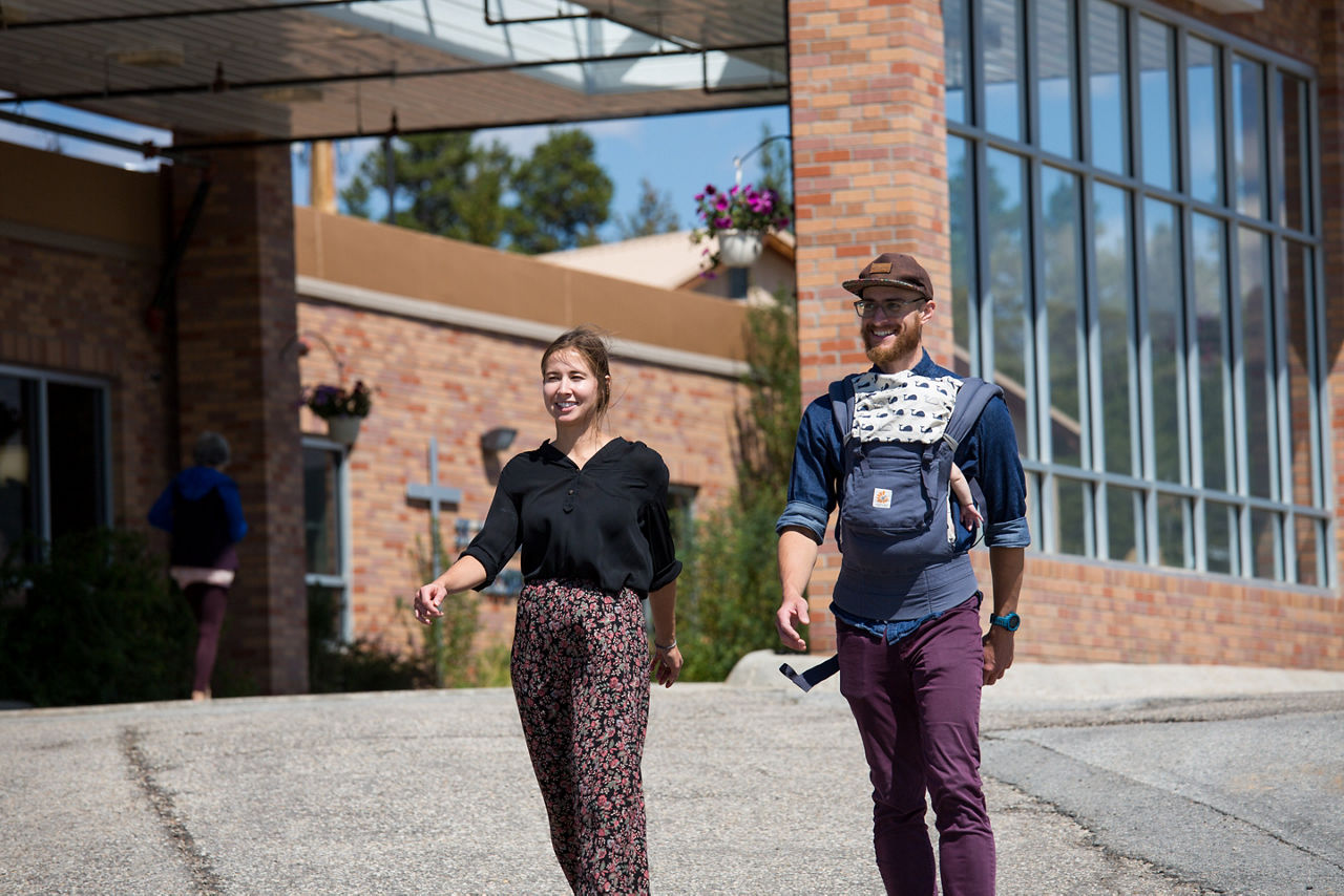Mara Gwin and Noah Sosin, from Lake County Build a Generation have a "walk and talk" meeting while Noah's baby sleeps in Leadville, Colorado.  Gwin is the Organizational and Resource Development AmeriCorps VISTA and Sosin is the Resilient Lake County Manager, who works with residents of manufactured home communities to foster civic engagement and empower the residents to advocate for their rights as tenants.