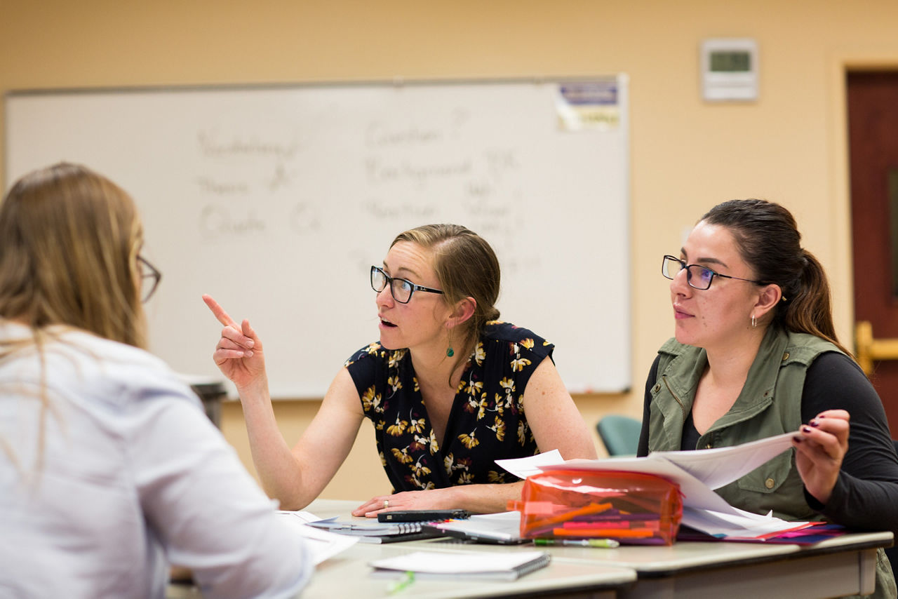 Erin Allaman, associate professor of teacher education at Colorado Mountain College in Leadville, Colorado talks with student Analy Gurrola during an Introduction to Education class.