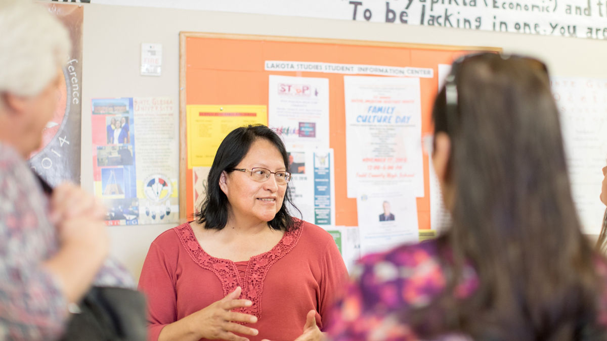 Todd County, South Dakota, 2019. Rosebud Reservation.The Lakota Studies Tipi Building located at Sinte Gleska University.Jacqueline White Bird (center in red) is an Adjuct Professor. She also develops curricula at the Tipi Building.