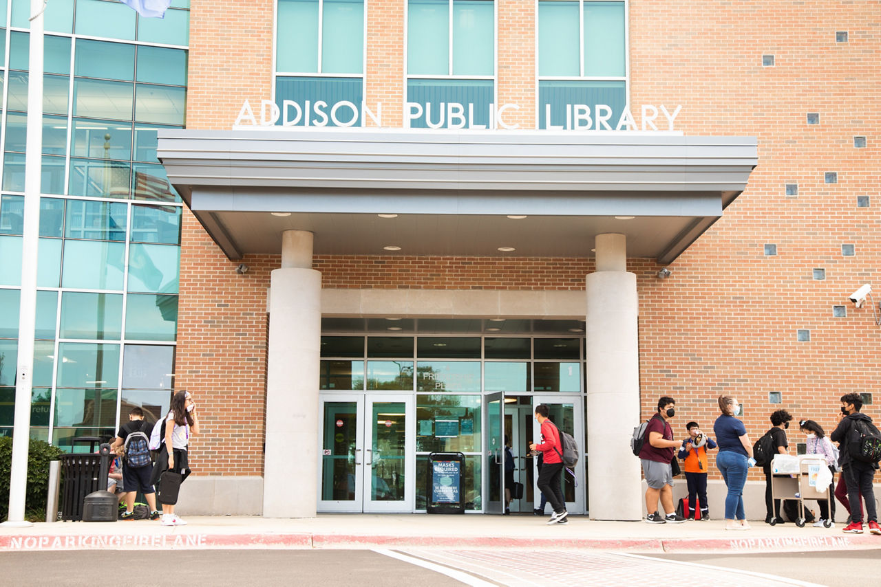 Kids arriving at the Public Library after school, Addion, IL.