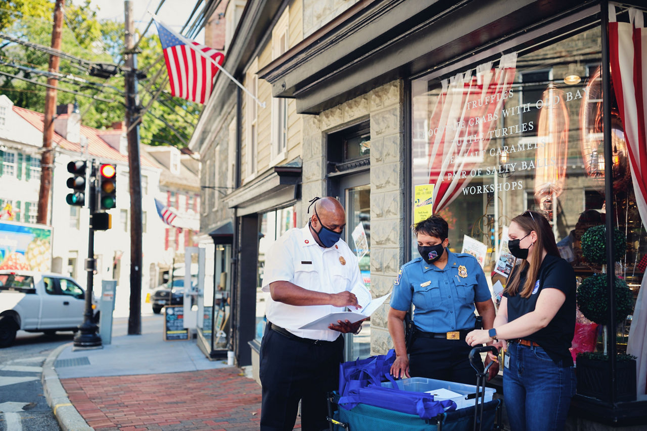 [NOTE: Film crew has names/releases for everyone in photo]Howard County Police Chief Lisa Myers and Fire Chief Louis Winston at a community event in Ellicott City handing out emergency preparedness kits including information and a weather alert radio.Myers is the first woman and the first black police chief for Howard County, MD.
