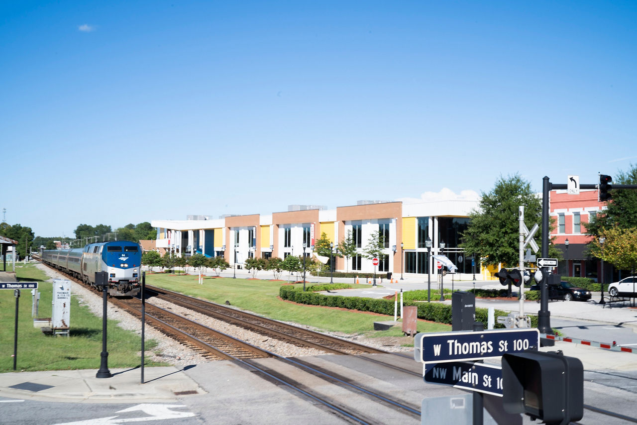 The station in downtown Rocky Mount serves Amtrak lines as well as CSX. The tracks separate Edgecombe and Nash counties along historically racial lines. The county line was moved from the Tar River to the railroad tracks in 1871 roughly when when the region’s tobacco, cotton, and naval stores began to ship by railroad instead of the river. Rocky Mount, NC. September 23, 2021 (Photo by Samantha Appleton)In the face of historical challenges, the people of Rocky Mount, N.C., are embarking on a journey to address structural racism and racial equity as key drivers of health. This rural town of 54,000 is working to make the city’s power structure more inclusive, encourage collaboration between generations and racial groups, and address the root causes of racism. Residents are taking an expansive view of health and fostering connections around such critical issues as affordable housing, workforce development and wealth building, and access to healthy foods.