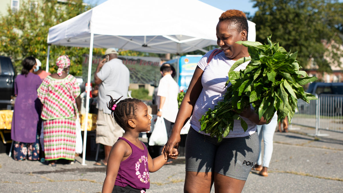 Worcester, MA  Tawa Woods (mom) and 3 year old Tanusha Woods at the Worcester Farmers Market. Tawa is originally from Liberia and has lived in Worcester for 10 years.