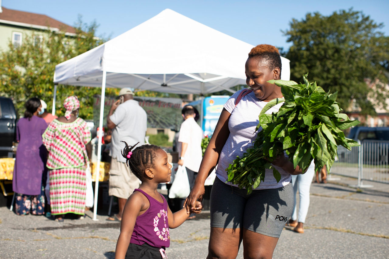 Worcester, MA  Tawa Woods (mom) and 3 year old Tanusha Woods at the Worcester Farmers Market. Tawa is originally from Liberia and has lived in Worcester for 10 years.