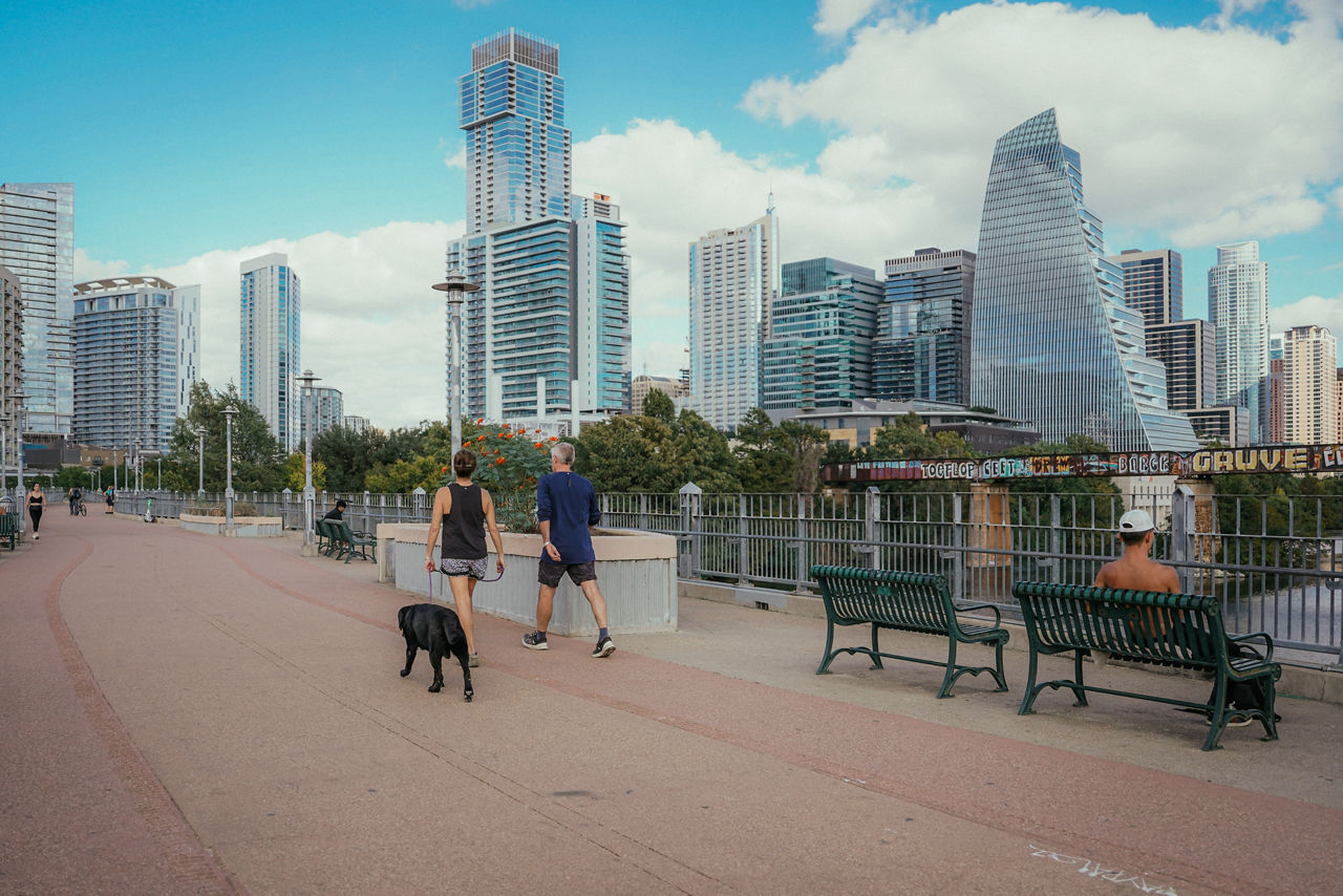 Austin residents enjoying a walk along The Congress Avenue Bridge.