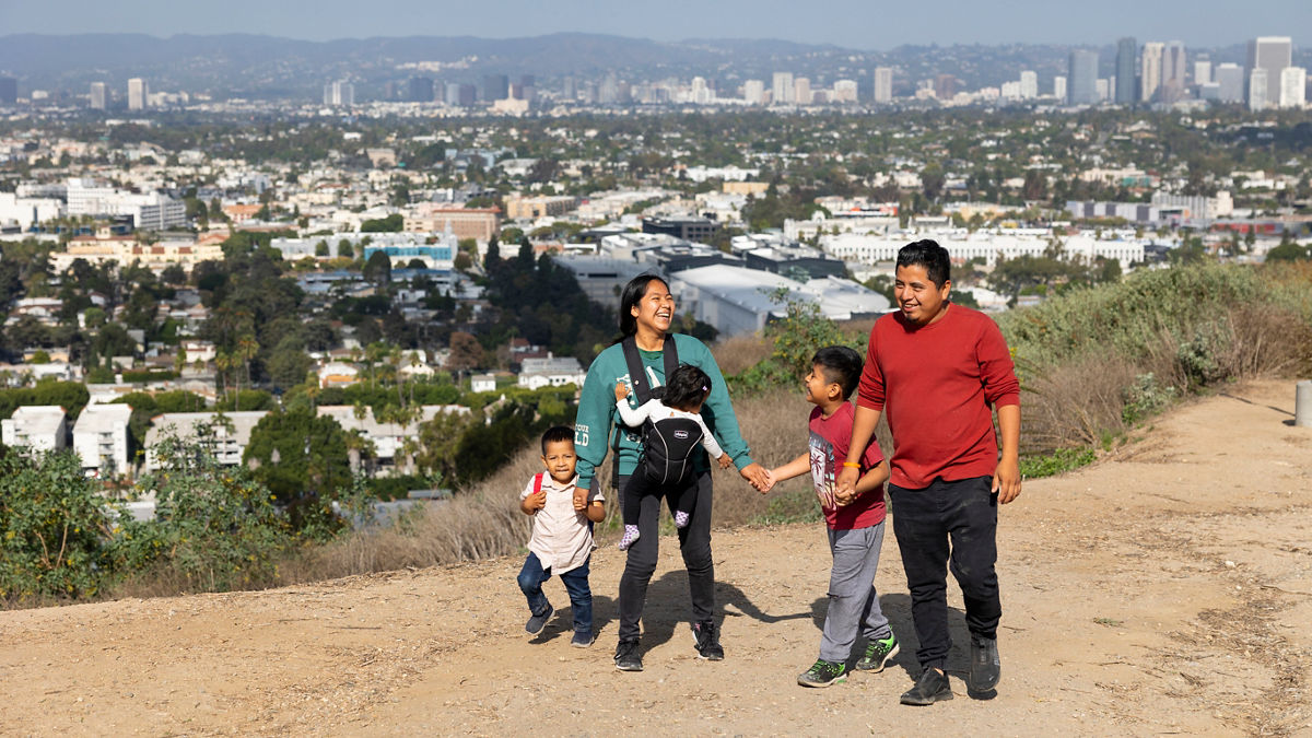 Greimy Hernandez and Helder David López Dueñas  go on a hike with their children Eli, 8, Jafeth, 3, and Yuna, 18 months, at the Baldwin Hills Scenic Overlook Trail in Los Angeles, California.