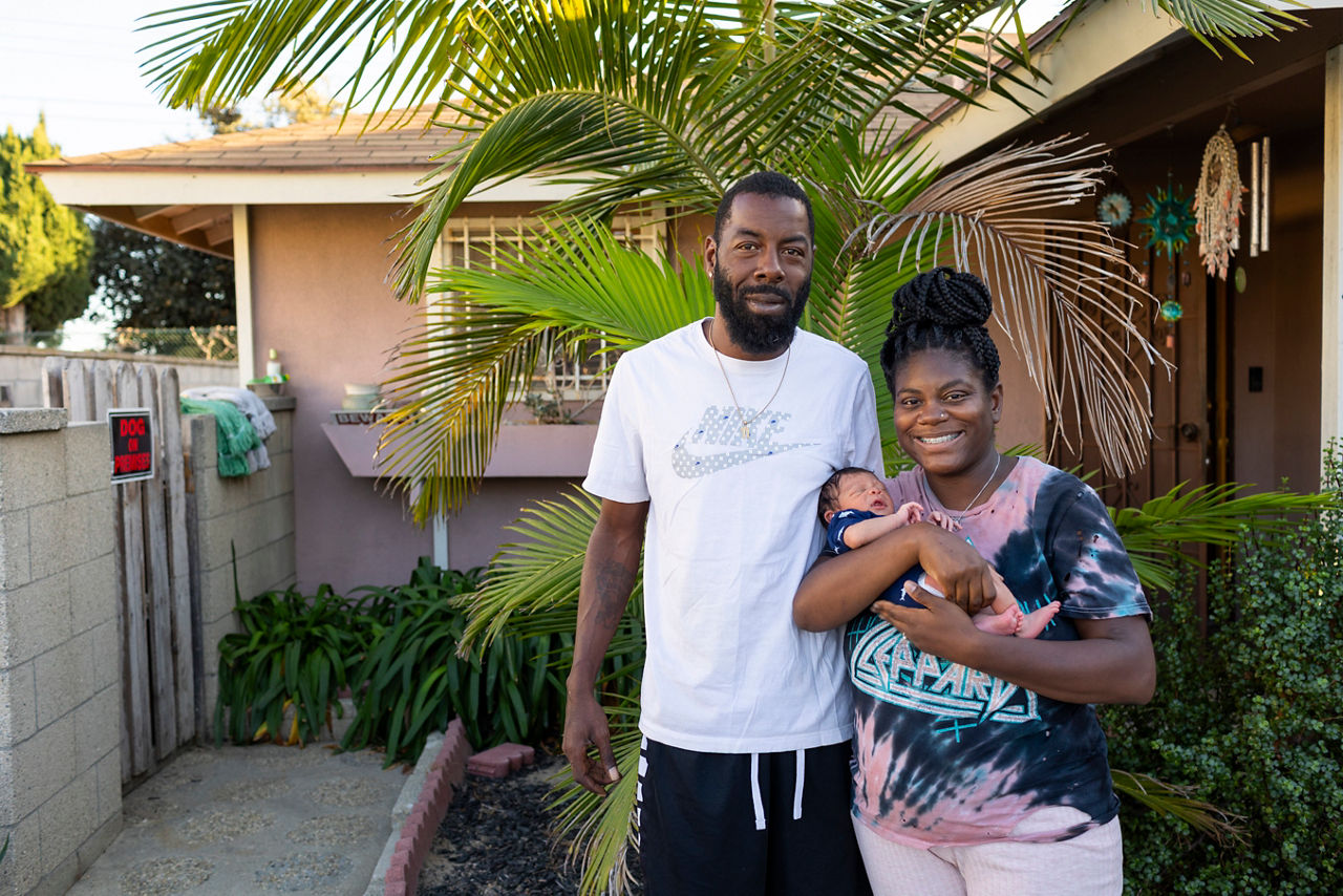 Jessica Brown and Chris Johnson hold their 1 week old baby Noah in front of Jessica's home in Carson, California on October 22, 2023.